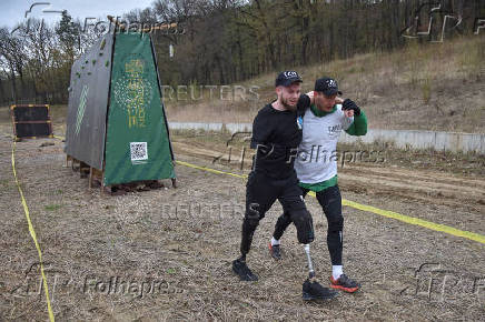 Ukrainian war veterans attend a race with obstacles in Vynnyky, ouside of Lviv