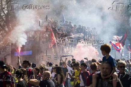 Players of Bologna FC and fans celebrate in Bologna