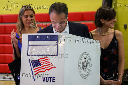 Andrew Cuomo votes in the New York City primary election in New York