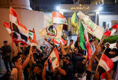 Iraqi people celebrate what they say is Iran's victory, in Baghdad