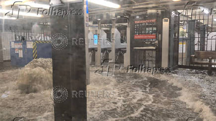 A view shows a flooded subway station in New York