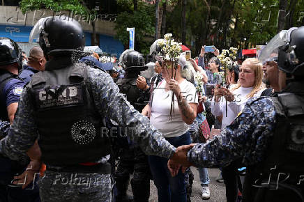Relatives of detained Venezuelans, walk to the Miraflores presidential palace, in Caracas