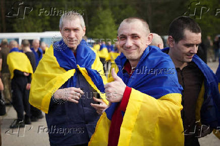 Ukrainian POWs are seen after a swap at an unknown location in Ukraine
