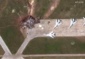 A satellite image shows a destroyed TU 22 aircraft in the aftermath of a drone strike at the Belaya air base