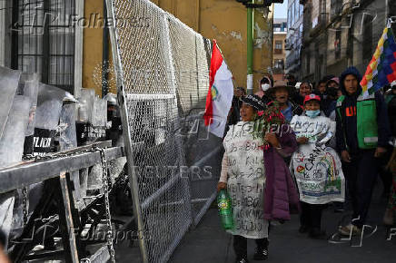 Evo Morales supporters march in mourning amid economic crisis, in La Paz