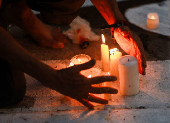 Family members and friends of missing persons participate in a candlelight vigil, in Mexico City