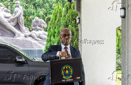 Rwanda?s Minister of Finance and Economic Planning, Yusuf? Murangwa, holds the briefcase containing the Government Budget for the 2025/26 fiscal year at the Parliament in Kigali