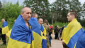 Ukrainian POWs are seen after a swap at an unknown location in Ukraine
