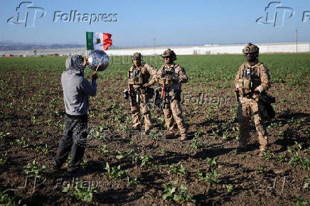 U.S. federal agents and immigration officers raid an agricultural facility in Camarillo