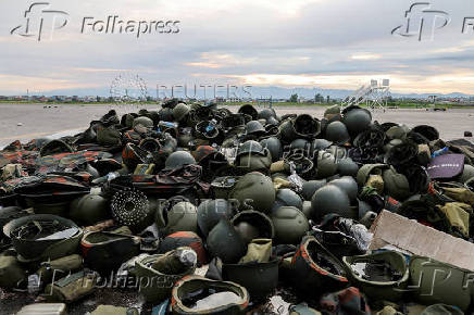 FILE PHOTO: Abandoned military helmets that belonged to the Armed Forces of the Democratic Republic of Congo (FARDC) is seen at Goma airport