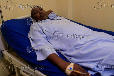 A dengue fever patient receives intravenous fluids at a hospital in Khartoum