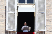 Pope Leo XIV leads the Regina Caeli prayer from his window in St. Peter's Square, at the Vatican