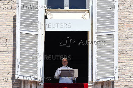 Pope Leo XIV leads the Regina Caeli prayer from his window in St. Peter's Square, at the Vatican