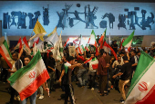 Iraqi people celebrate what they say is Iran's victory, in Baghdad