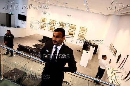 Security personnel stand guard with Sotheby's
