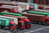 FILE PHOTO: Gantry cranes stand near shipping containers at Yangshan Port outside of Shanghai