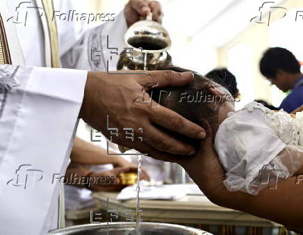 Mass baptism ceremony for children in Bacoor city