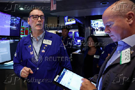 Traders work on the floor of the NYSE in New York