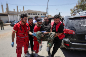 Casualties from recent clashes in Sweida receive treatment at a field medical point in Deraa