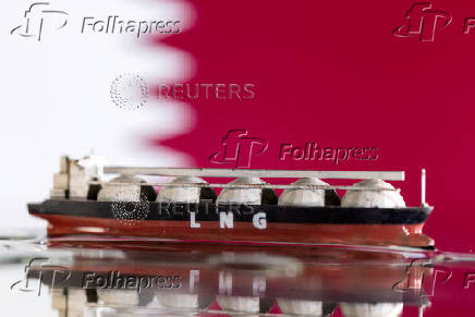 FILE PHOTO: Illustration shows model of LNG tanker and Qatar's flag