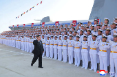 North Korean leader Kim Jong Un attends the launching ceremony of a warship that had been damaged upon its first attempt to launch