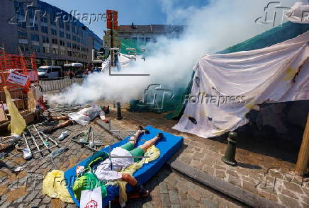 Health unions and workers protest use of aid withholding as weapon of war in Brussels