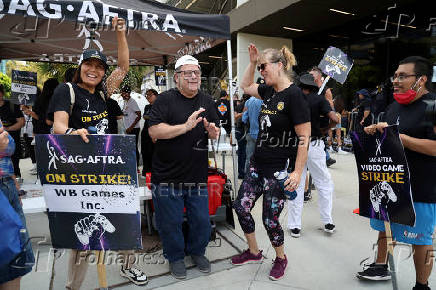 FILE PHOTO: Activists and members take part in the SAG-AFTRA Video Game Strike kick-off picket outside Warner Bros. Games in Burbank