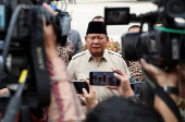 Indonesian President Prabowo Subianto speaks to members of the media at the Halim Perdanakusuma military airbase, in Jakarta