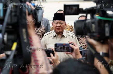 Indonesian President Prabowo Subianto speaks to members of the media at the Halim Perdanakusuma military airbase, in Jakarta