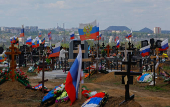 People visit a cemetery in Donetsk