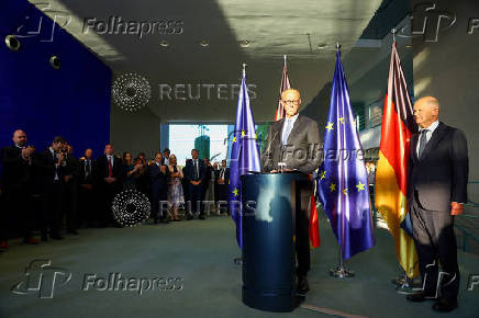 German Chancellor Olaf Scholz hands over to his successor Friedrich Merz