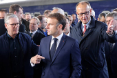 Emmanuel Macron, Keir Starmer and Friedrich Merz arrive at Kyiv railway station