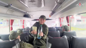 Russian soldiers pose for cameras in Belarus after release from Ukraine on second day of POW exchange