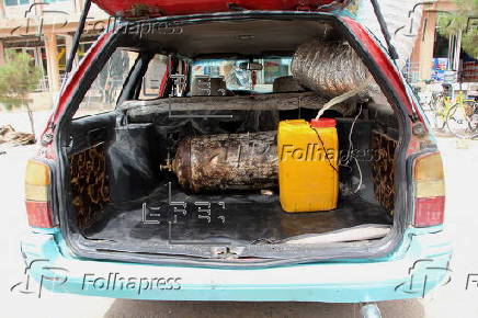 Taxi drivers install locally made air coolers to beat the heat in Kandahar