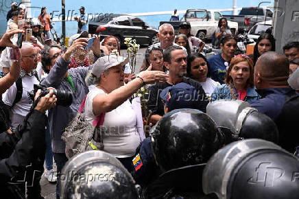 Relatives of detained Venezuelans, walk to the Miraflores presidential palace, in Caracas