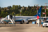 A Boeing jet intended for use by a Chinese airline returns to Boeing Field, in Seattle, Washington