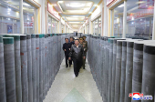 North Korea's leader Kim Jong Un visits a factory that makes shells and machinery