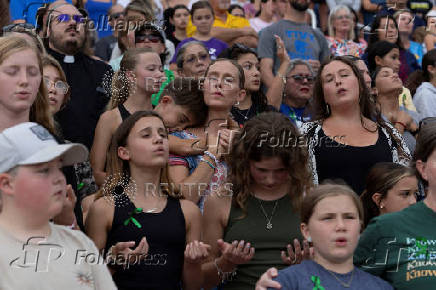 People attend a prayer service for flood victims in Kerrville