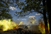 Members of the National Police Special Purpose Battalion fire howitzer towards Russian troops on a front line in Zaporizhzhia Region