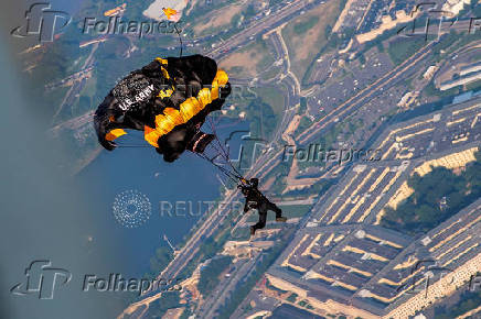 U.S. Army Golden Knights parachute team perform during the Twilight Tattoo ceremony