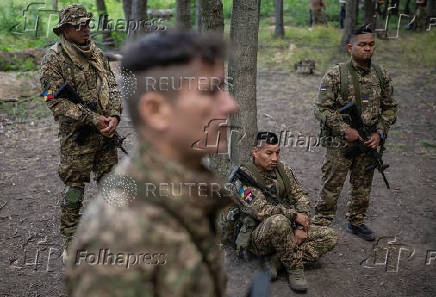 Foreign volunteers of the Ukrainian National Guard brigade attend military exercises at a training ground near a front line in Kharkiv region