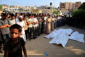 Aftermath of an early morning Israeli strike on a tent sheltering displaced people, in Khan Younis