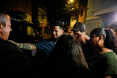 Arturo Suarez, who was held for months in an El Salvador prison, greets family members after his release, in Caracas