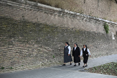 Nuns walk near the Vatican after the election of Pope Leo XIV, as seen from Rome