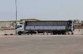 A truck carrying aid is parked at the Kerem Shalom crossing between Israel and Gaza, before going into Gaza, on the Israeli side of the Israel-Gaza border
