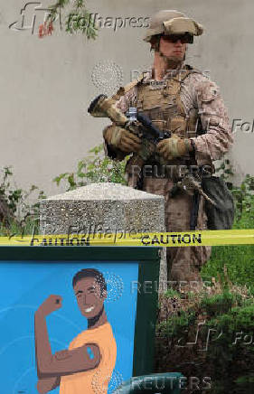 A U.S. Marine guards the Wilshire Federal Building in Los Angeles