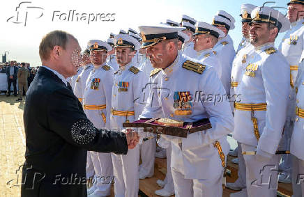 Russian President Vladimir Putin attends a ceremony of raising a naval flag aboard the Knyaz Pozharsky nuclear-powered ballistic missile submarine in Severodvinsk