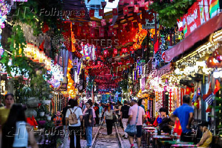 Tourists visit Hanoi Train Street, one of the famous tourist destinations in Hanoi