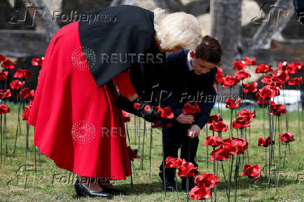 Britain's Queen Camilla views an installation of 30,000 ceramic poppies commemorating the 80th anniversary of Victory in Europe (VE) Day in London