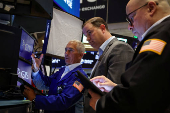 Traders work on the floor of the NYSE in New York